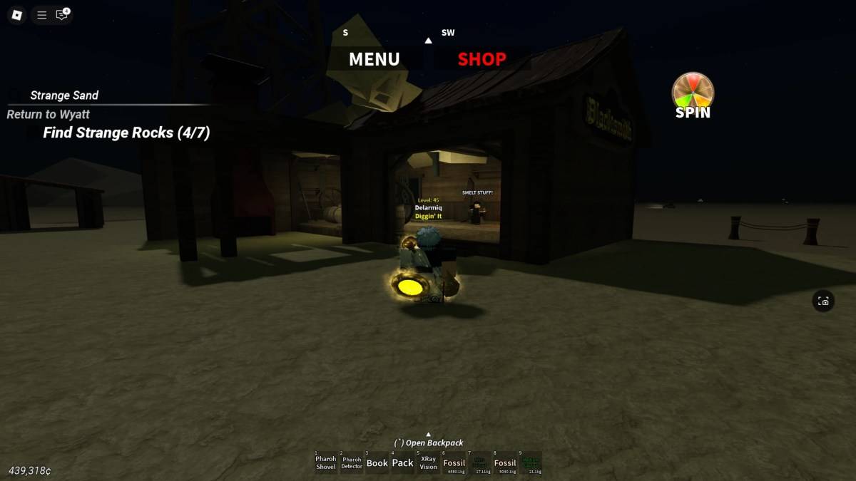 Player positioned by the blacksmith building in Desert Detectors